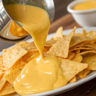 Creamy Cheddar Cheese Sauce Being Poured