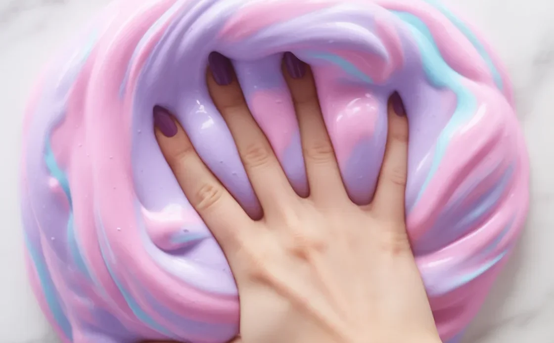 A colorful bowl of fluffy slime made with glue and shaving cream, showcasing its airy texture.